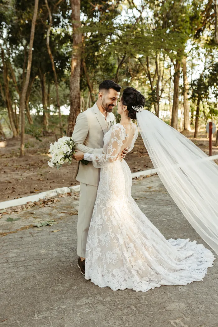 Newlyweds hugging outdoors