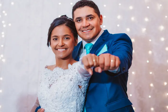 Couple showing wedding rings