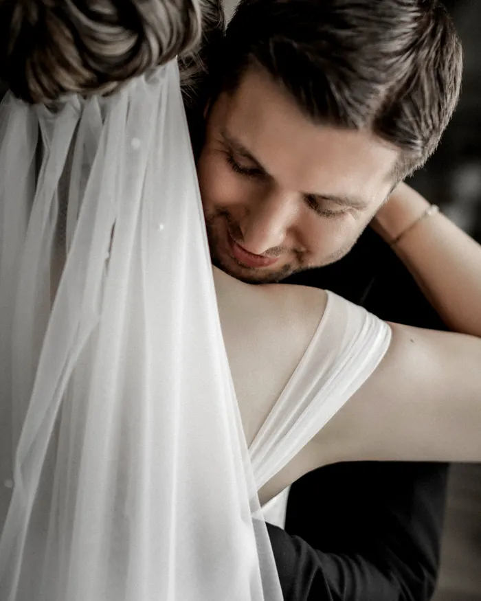 Bride and groom embracing