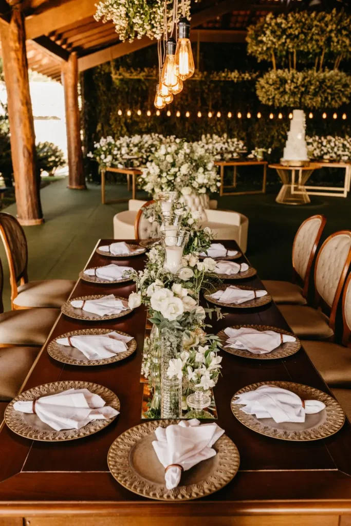 Reception table with flowers and candlelight