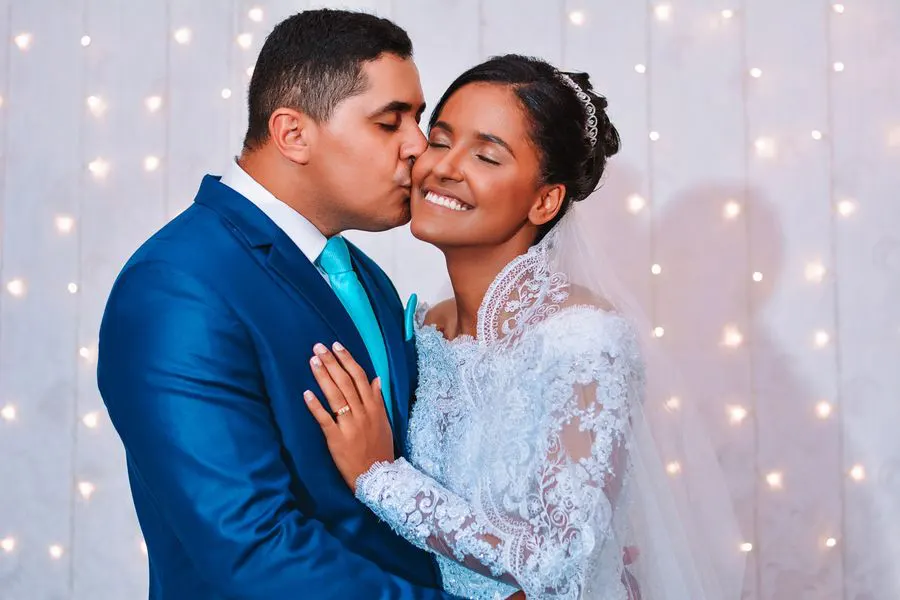 Groom kissing the bride on the cheek