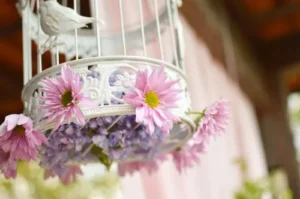 Birdcage with pink flowers