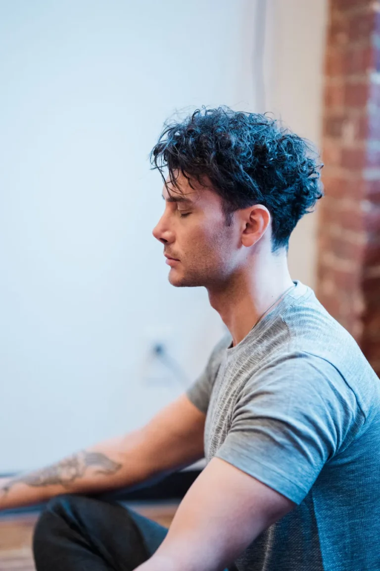 Man meditating with his eyes closed