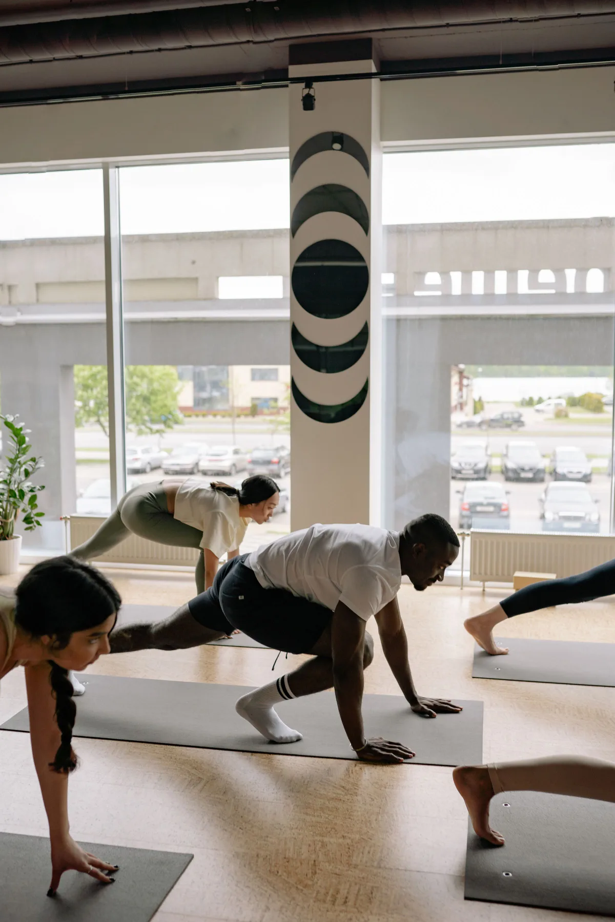 Group class holding a standing pose